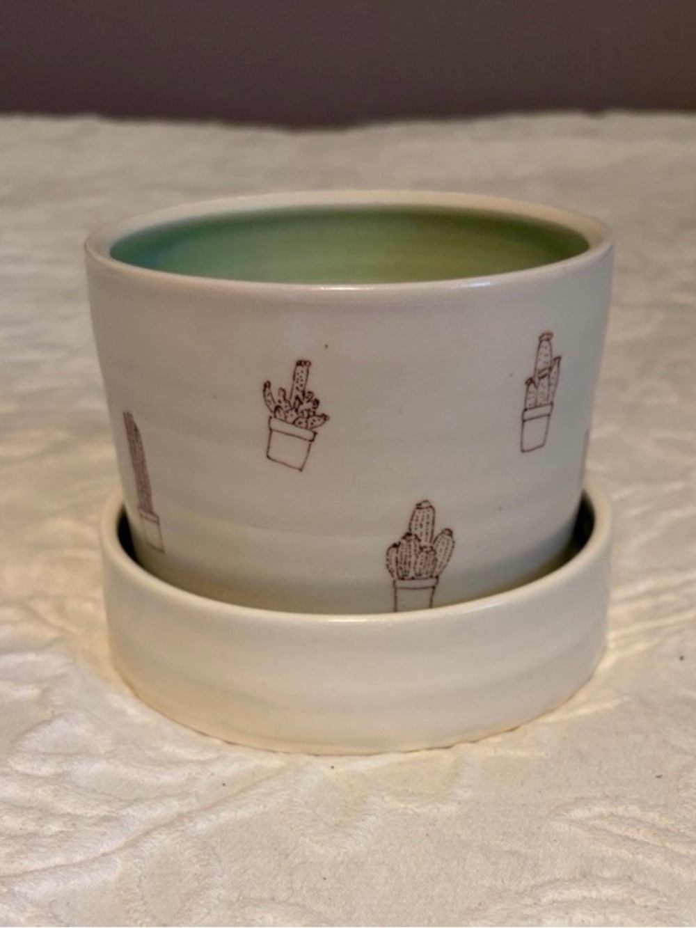 Whimsical White Ceramic Planter with Green Interior and Cactus Motif - Picture 11 of 11